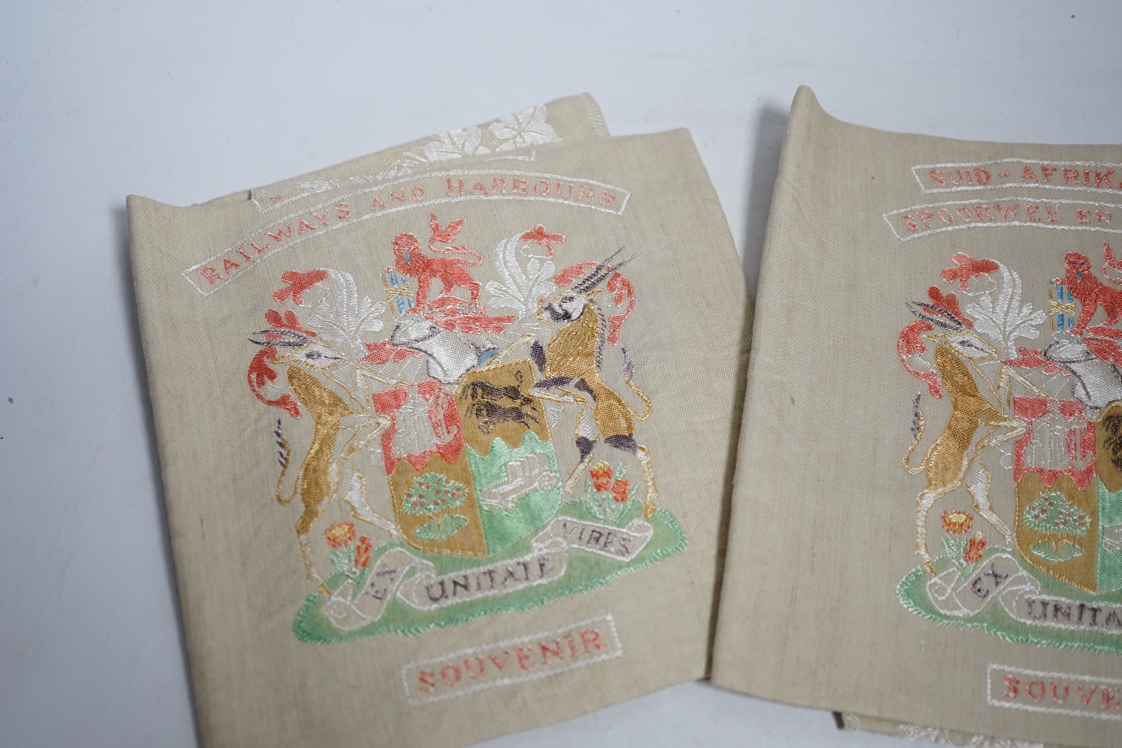 Two South African late 19th century damask railway napkins and a velvet rugby or cricketing cap